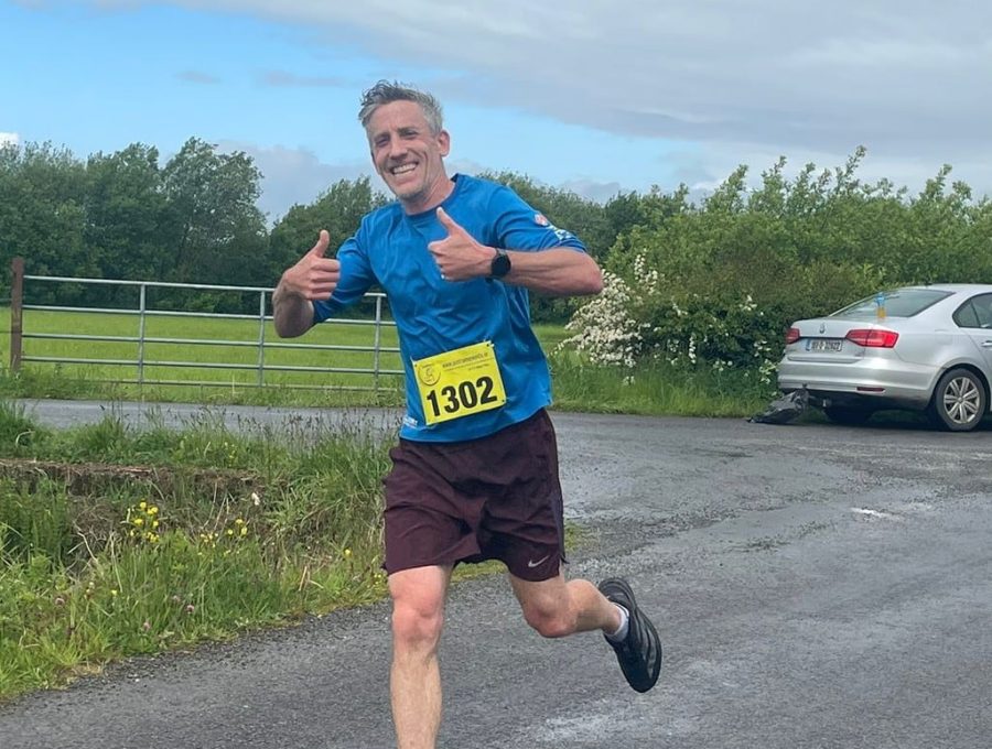 Derek running in a blue T-shirt