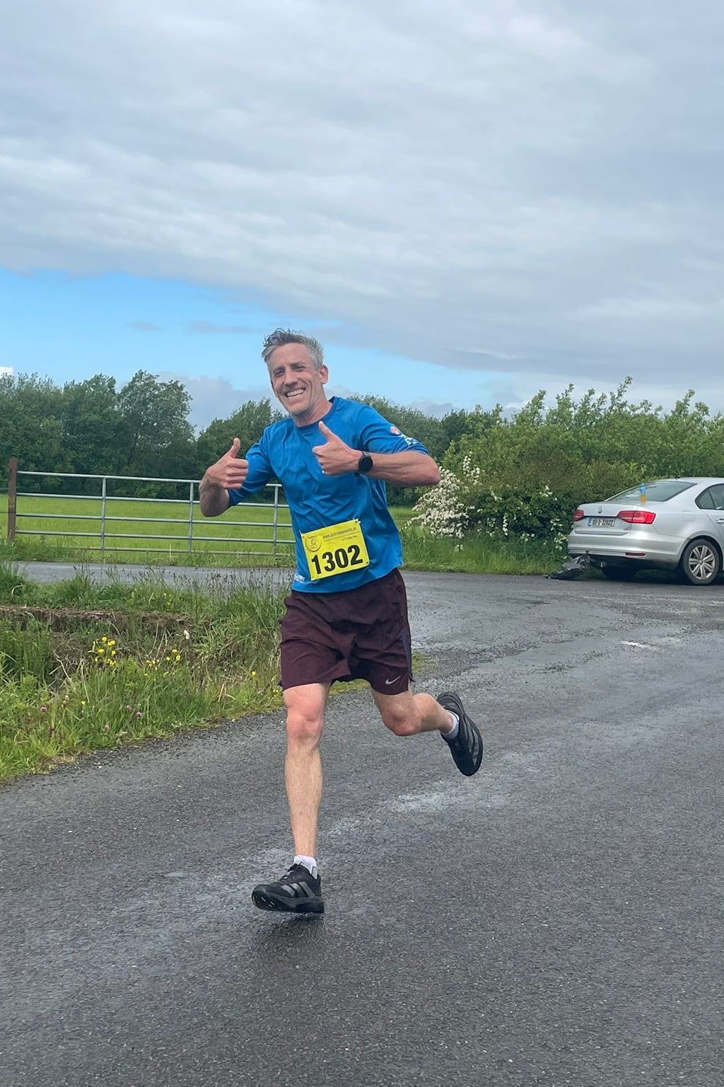 Derek running in a blue T-shirt